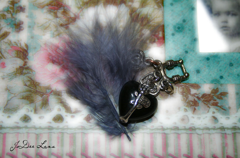 grey feather  with jewelry heart